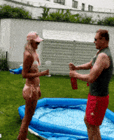 How To Make The Best Champagne Shower GIF? : Champagne shower GIF with a man wearing grey blazer suit with a red tie and a woman wearing beautiful pink bikini