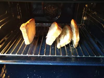 Fluffy Coco Bread Recipe - Vegan Tahitian Specialty : Coco bread slices grilling in oven