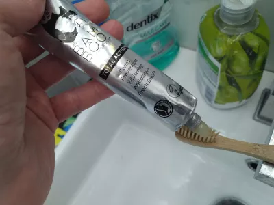 Best Eco-Friendly Toothpaste & Toothbrush Set: Dental Brands Review : Applying vegan Bam And Boo toothpaste on a bamboo toothbrush
