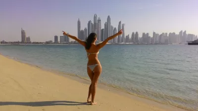 He Wants to See You in Your Bikini Because it’s Step One in a Relationship : Happy woman in bikini on the beach in Dubai